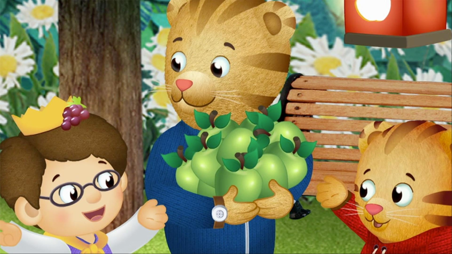 Daniel enjoys a Fruit Festival in the Enchanted Garden. / Dad Tiger builds a playhouse.